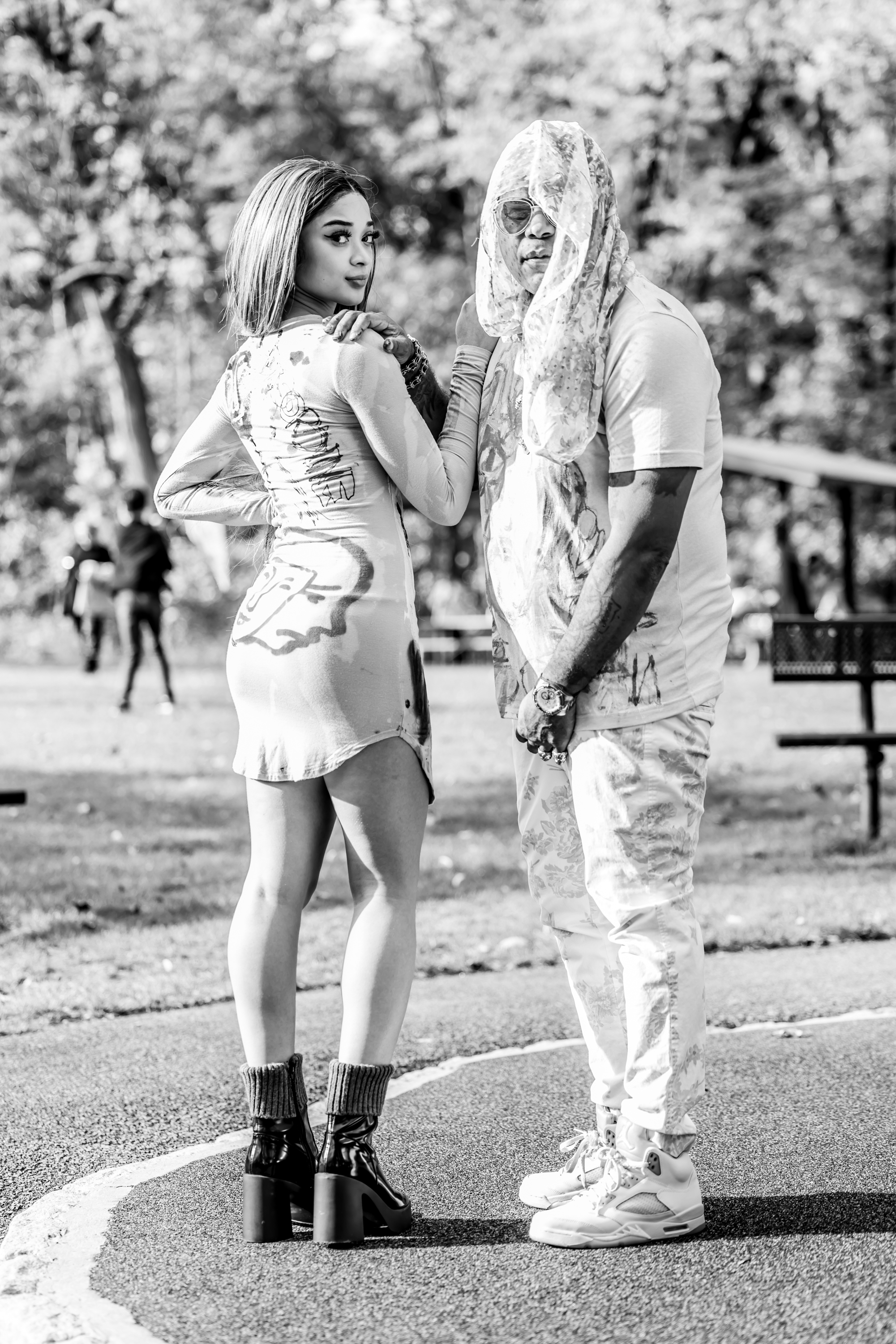 Franco and model posing together in hand-painted DiSoRdInE pieces, black and white editorial shot