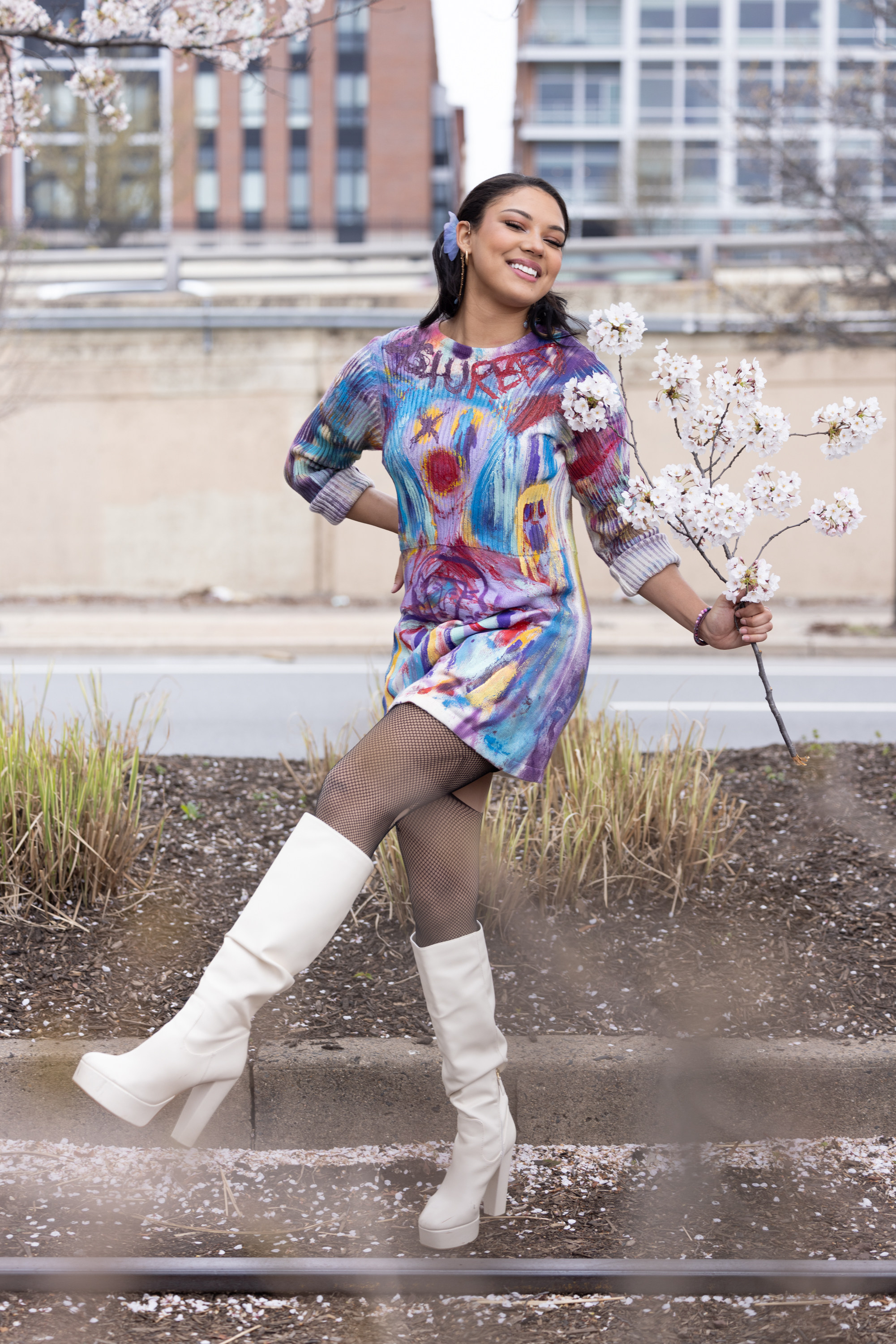 Model in hand-painted DiSoRdInE apparel along the Philadelphia waterfront