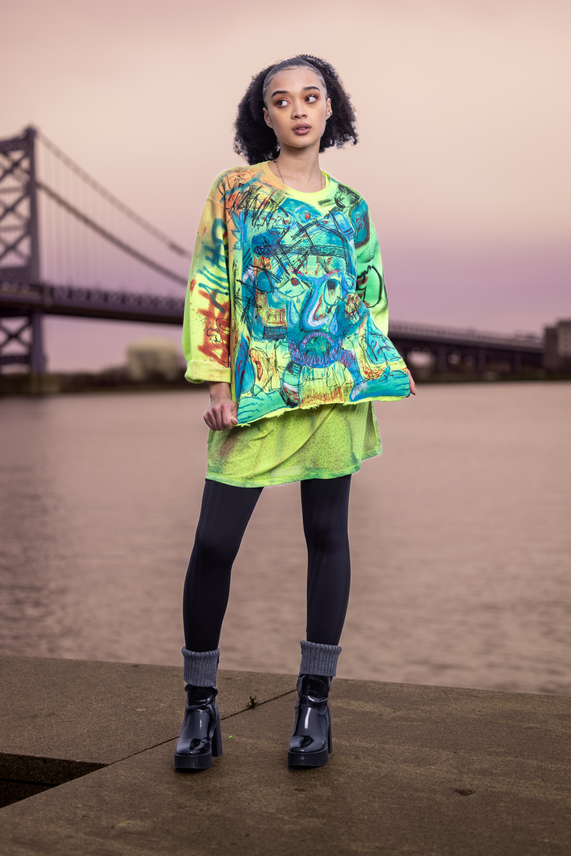 Model posing in a hand-painted DiSoRdInE original at the Philadelphia waterfront