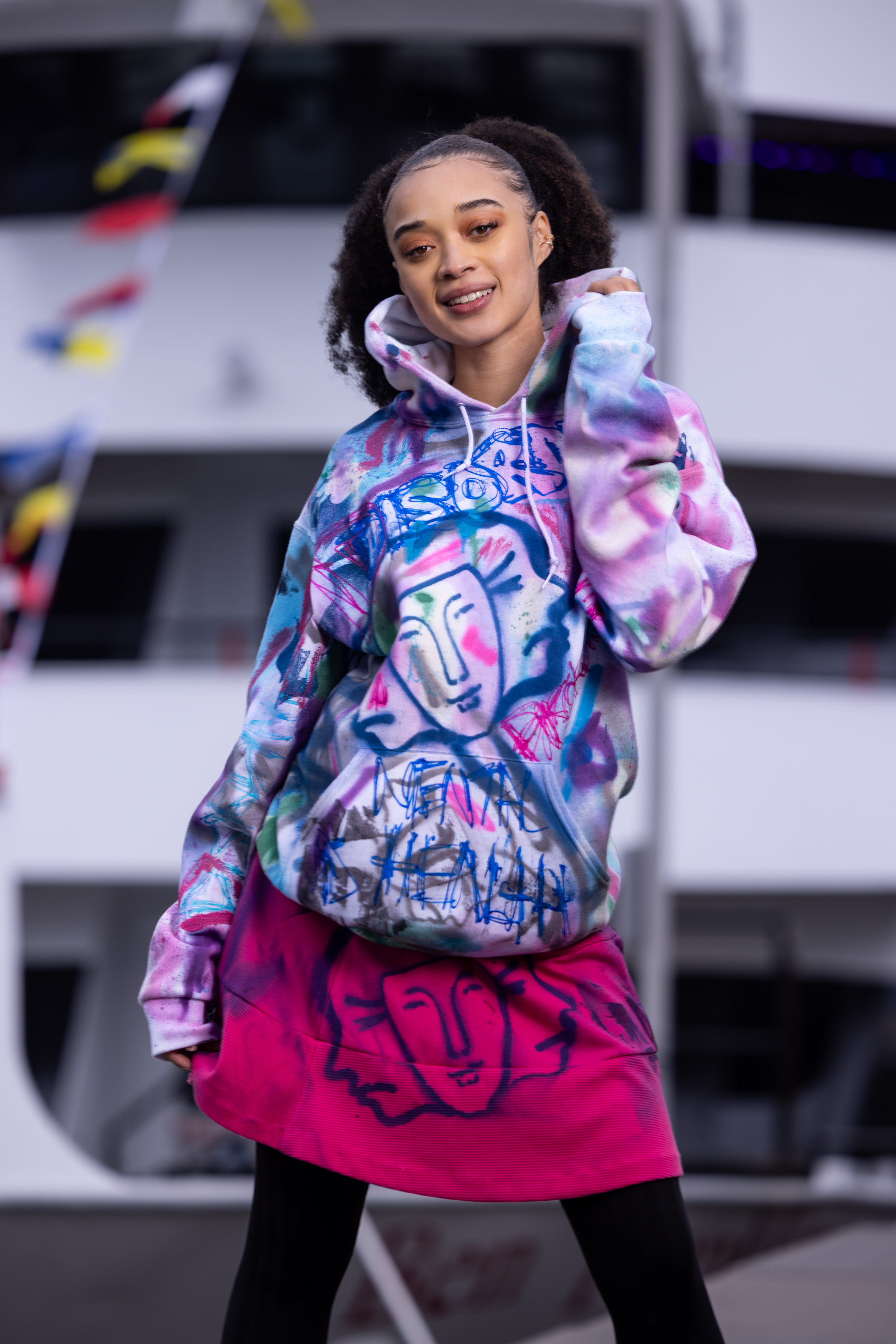 Model showcasing a hand-painted DiSoRdInE original at the Penn’s Landing waterfront